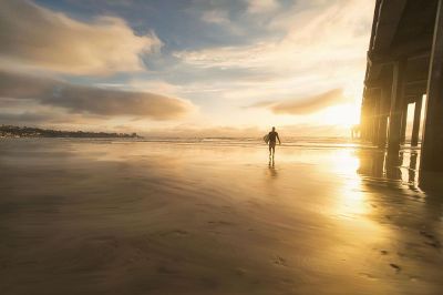 gentleman walking along a beach