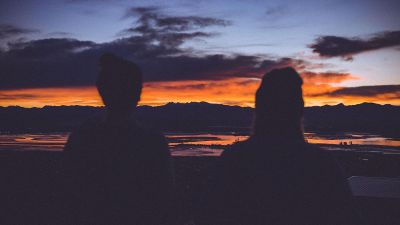 people sitting at sunset