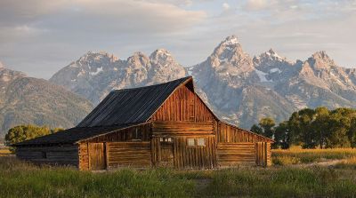 mountainside view behind a barn