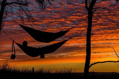 two hammocks on a sunset