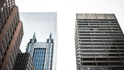 looking up at skyscrapers