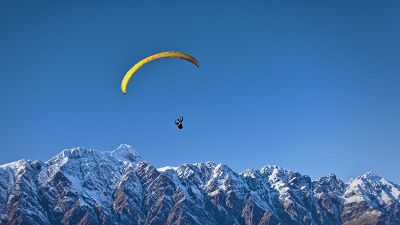 hang glider crossing the mountains