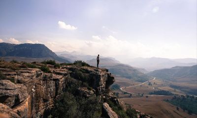 man standing on a cliff