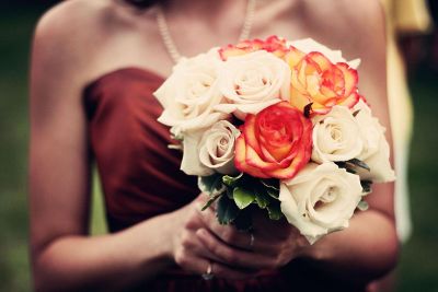 woman holding rose bouquet