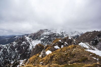 clouds on snowy mountain peaks