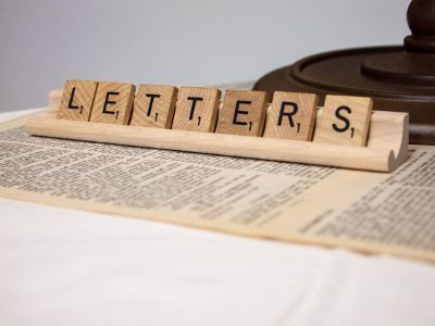 scrabble tiles spelling the word letters