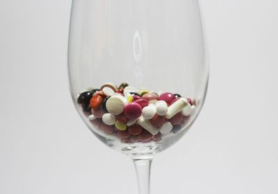 pills in a wine glass