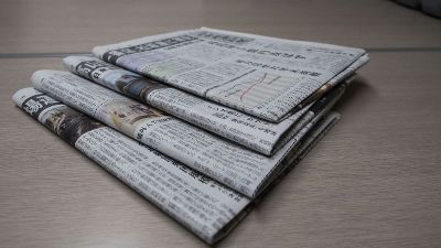 stacked newspapers