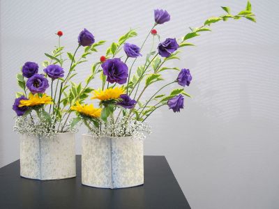 flowers in vases on table
