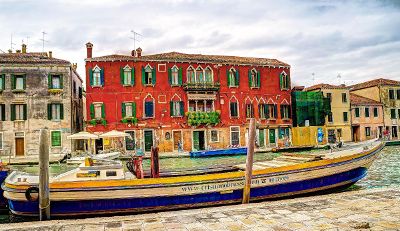 boat near colorful buildings