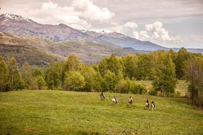 horseback riding in a valley