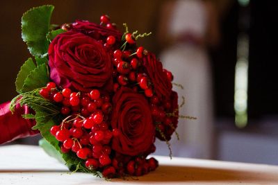 red roses and berries bouquet