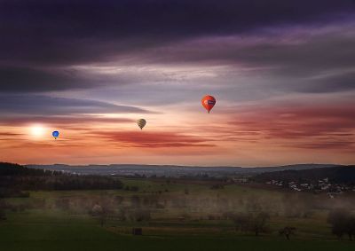 balloons over countryside