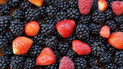 raspberries between black berries