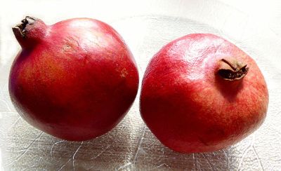 two pomegranates in a plate