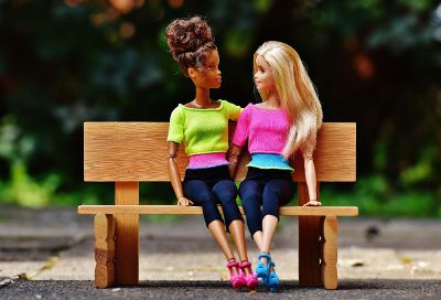 barbies on a bench