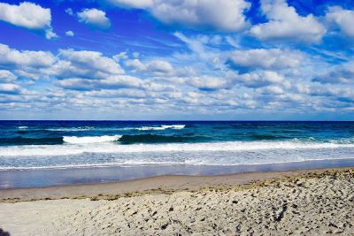 blue sky over waves