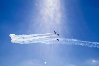 three airplanes in the sky