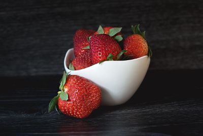 strawberries in white bowl