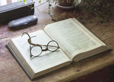 eyeglasses on an opened book
