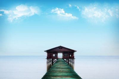 pier leading to house on water