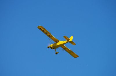 yellow prop driven plane