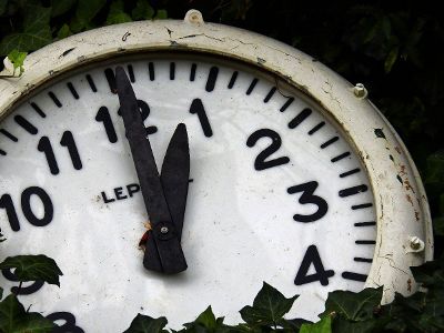 weathered ivy covered clock