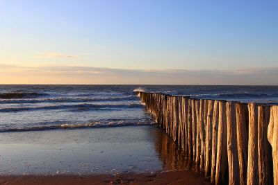 seaside scene with a wave breaker