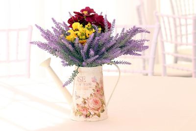 flowers in watering can