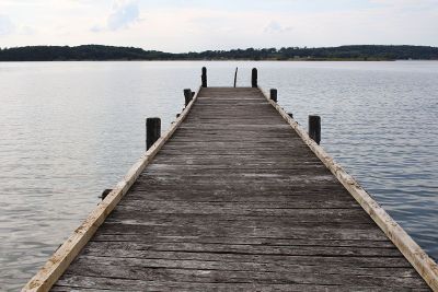 wooden dock extending into lake