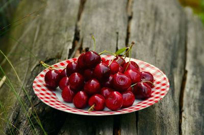 cherries in a dish in the park