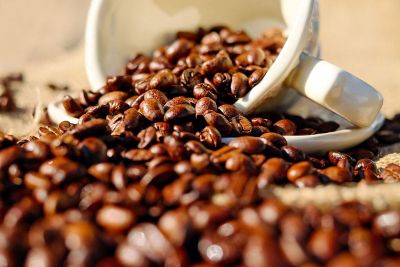 coffee beans spilling out of cup