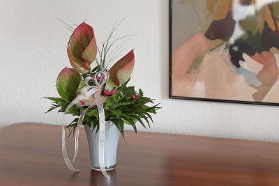 greenery arrangement in white vase