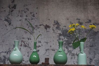 green vases with flowers