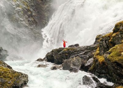 woman under waterfall