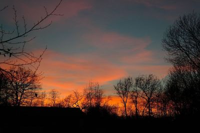 orange sunset lit clouds in fall