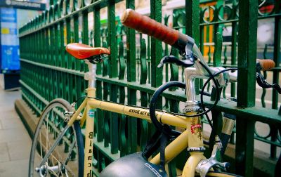 bike parked against fence