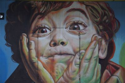 mural of boy on side of building