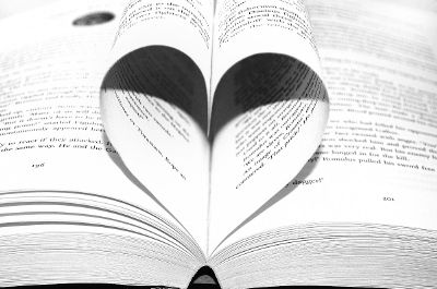 book pages curled into heart shape