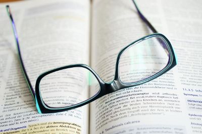glasses resting on book