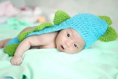 baby in crocodile suit