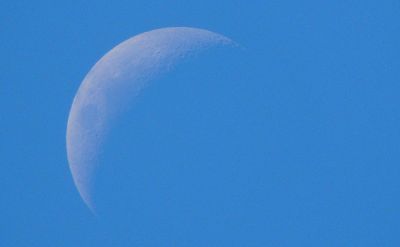 barely visible moon in daylight