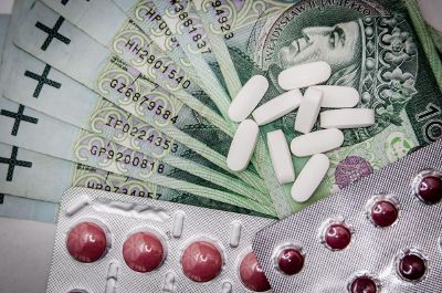 various pills on top of money