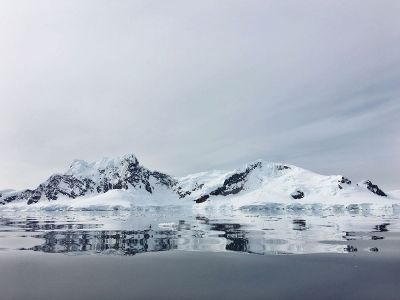 snowy mountains and icy water
