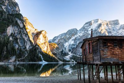 lake cabin on stilts in mountains