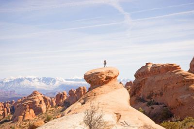 a man atop a rock formation