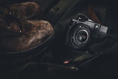 still life with boots and camera