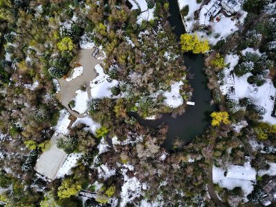 aeriel view of mansion in snow