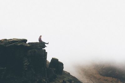 sitting on a cliff