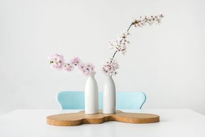 milk jug flowers on a table